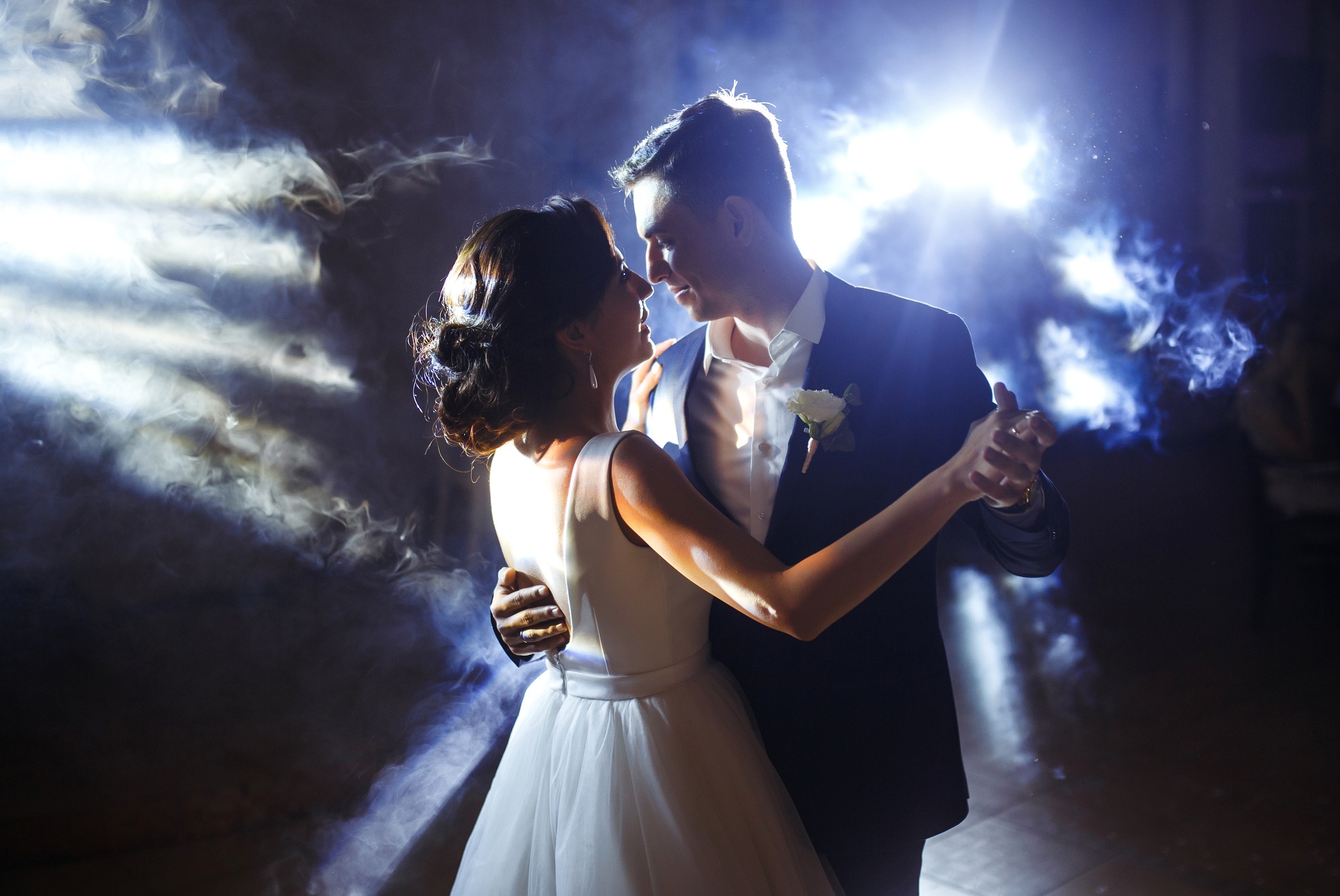 First wedding dance of newlywed. Wedding couple dancing in the darkness. . Happy bride and groom.